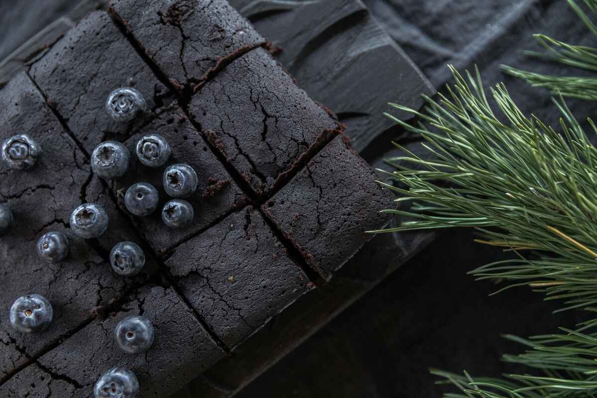 Assorted cakes on a black background representing safe eating after dental implants