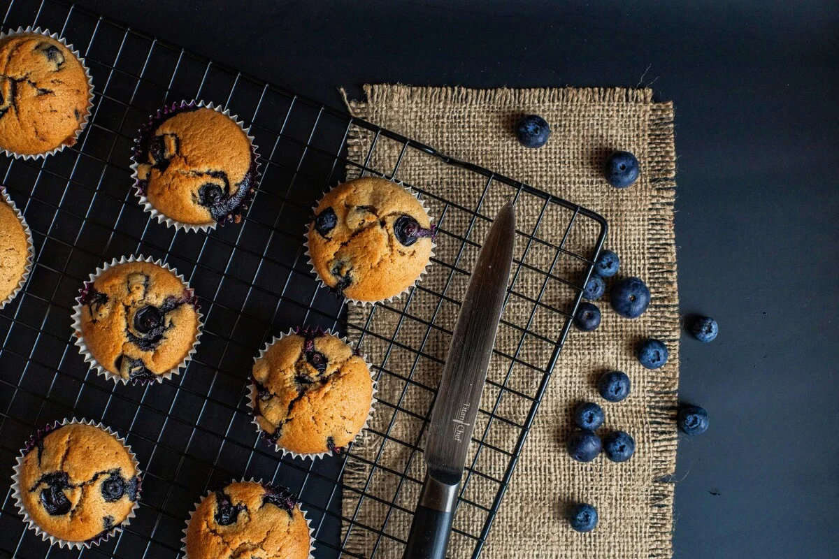 A soft plain muffin on a plate, suitable for eating after dental implant surgery